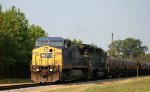 CSX 7915 leads a train towards the yard